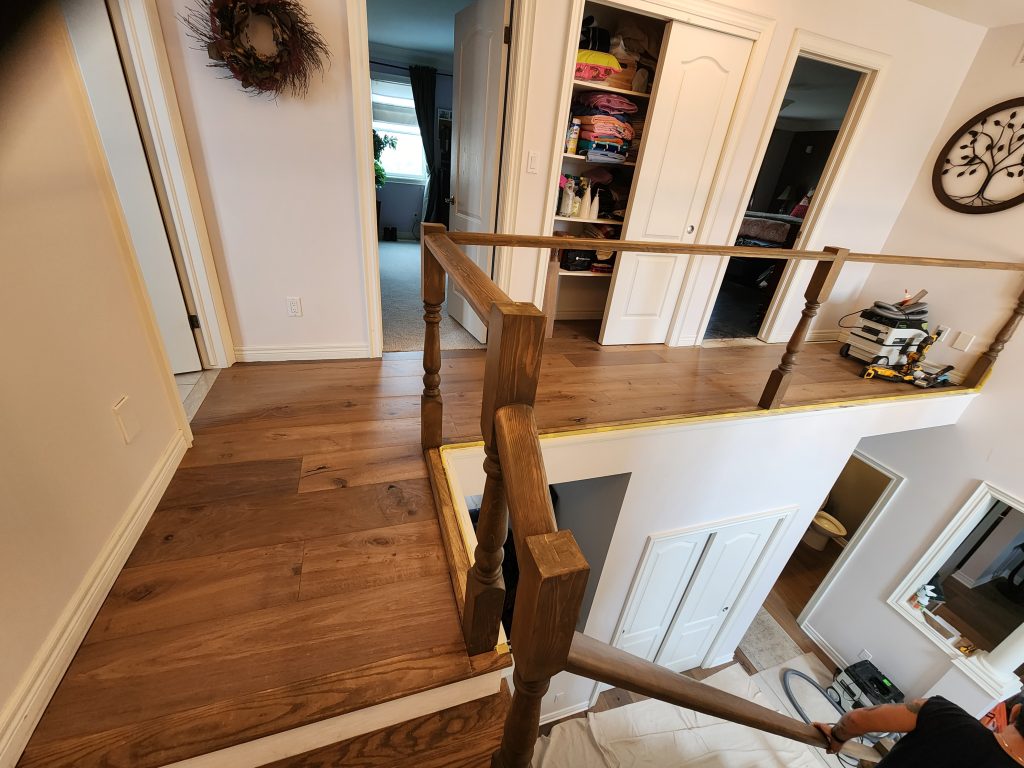 Staircase and hallway flooring install.