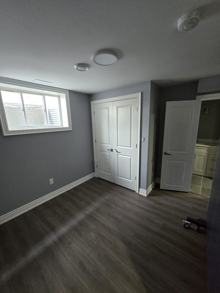 A freshly painting basement bedroom.